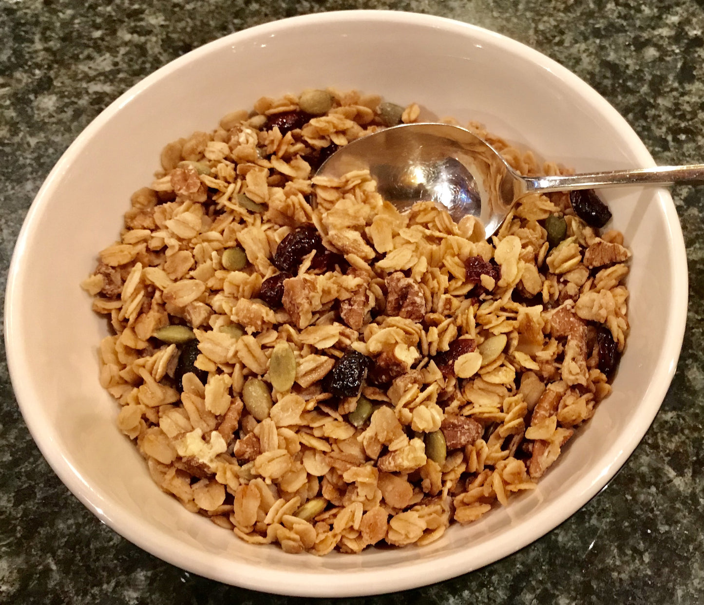 Bowl of Maple Granola with blueberries.  Made with pure organic maple sugar and organic oats. 