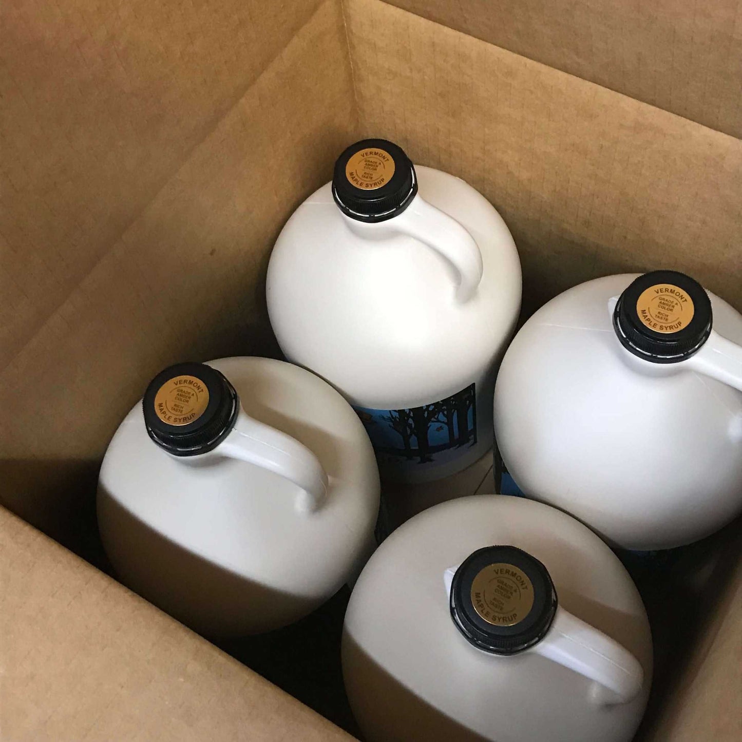 A bulk box of 4 of our 1 gallon jug of pure Vermont maple syrup. Available in amber and dark grades and in organic certified. 