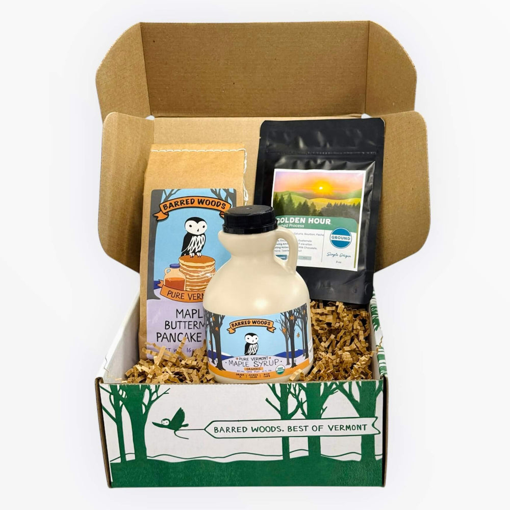 
                  
                    A breakfast gift basket with maple syrup, pancake mix and coffee.
                  
                