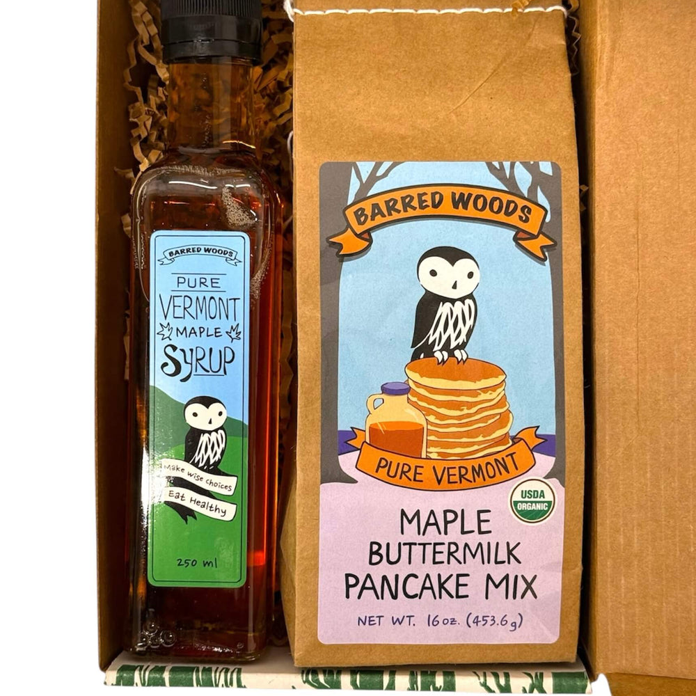 A Vermont maple gift containing a bottle of Pure Vermont Maple Syrup and a package of Barred Woods Pure Vermont Maple Buttermilk Pancake Mix.