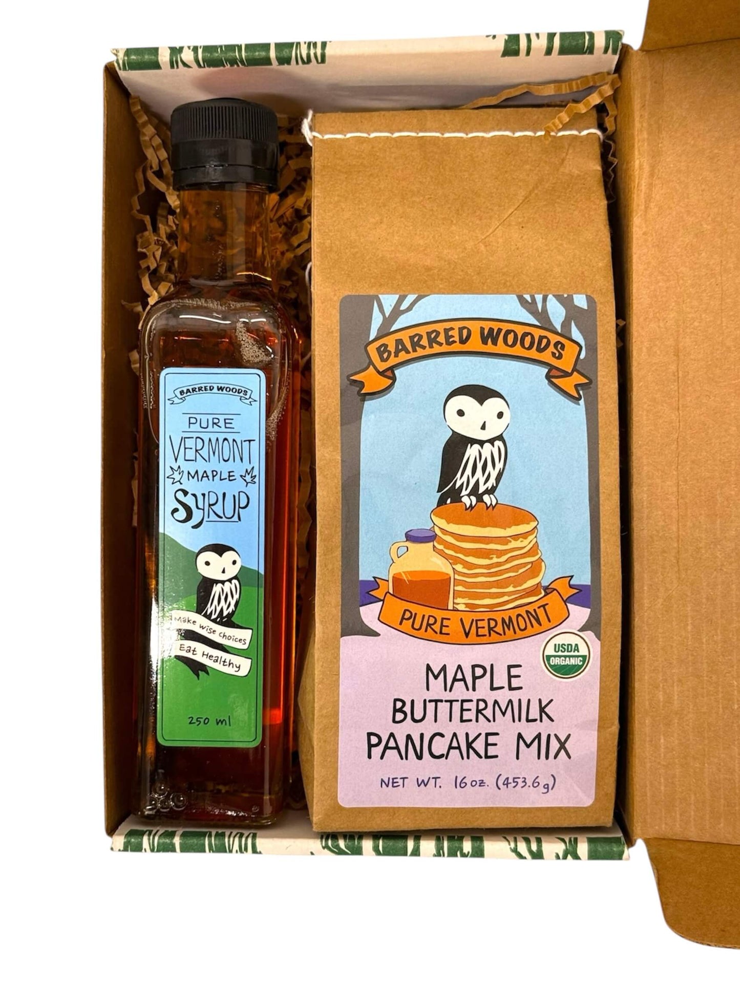 A Vermont maple gift containing a bottle of Pure Vermont Maple Syrup and a package of Barred Woods Pure Vermont Maple Buttermilk Pancake Mix.