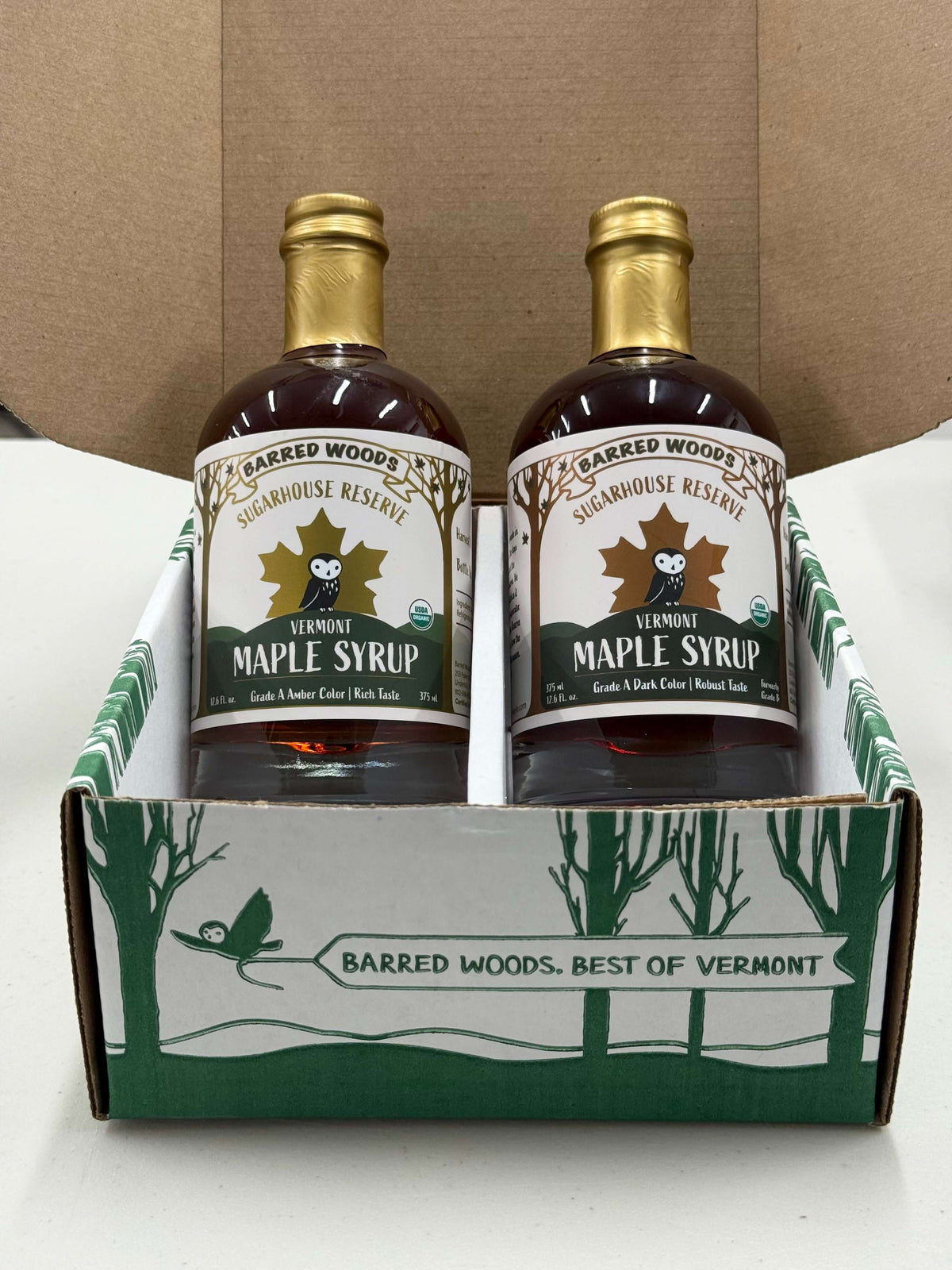 Two bottles of pure organic Vermont maple syrup, one of each grade.  Males a great sampler gift set of the various graders of maple syrup. 