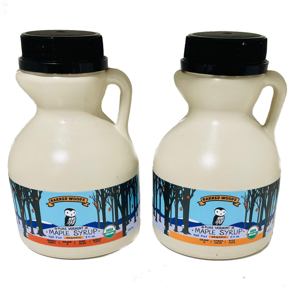 
                  
                    Two jugs of pure organic Vermont maple syrup - one jug of amber maple syrup and one jug of dark maple syrup. 
                  
                