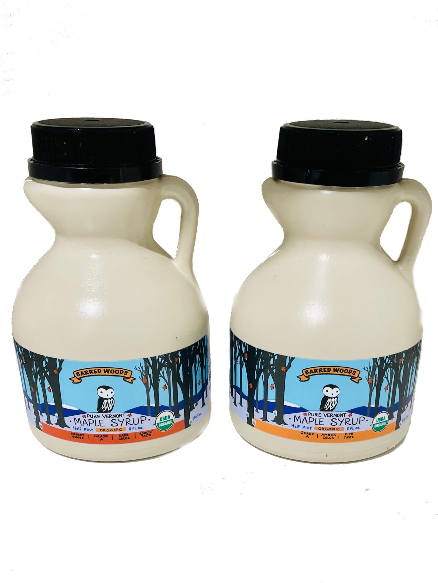 Two jugs of pure organic Vermont maple syrup - one jug of amber maple syrup and one jug of dark maple syrup. 