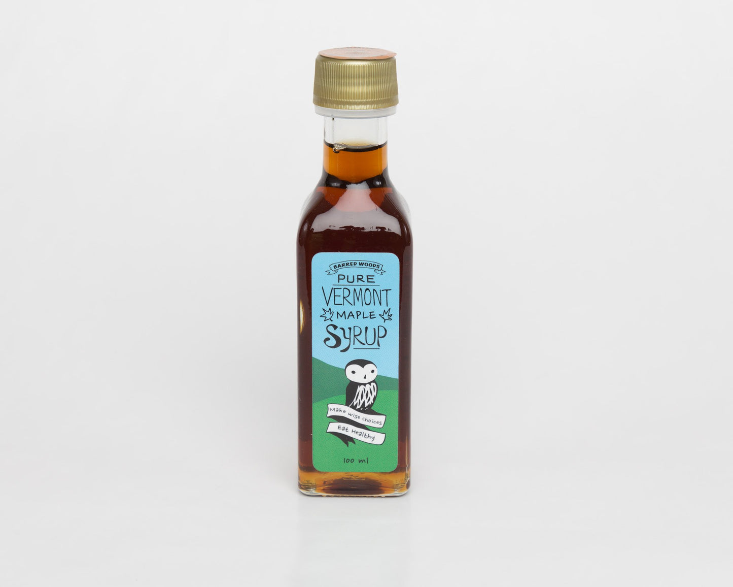 Small bottles of pure Vermont organic maple syrup