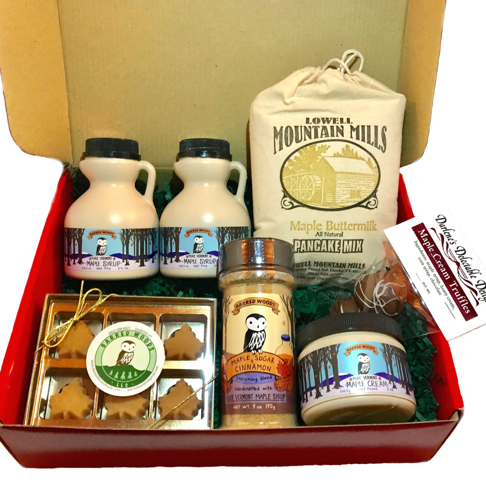 Maple gift box filled with maple treats including maple syrup and a maple candy gift box