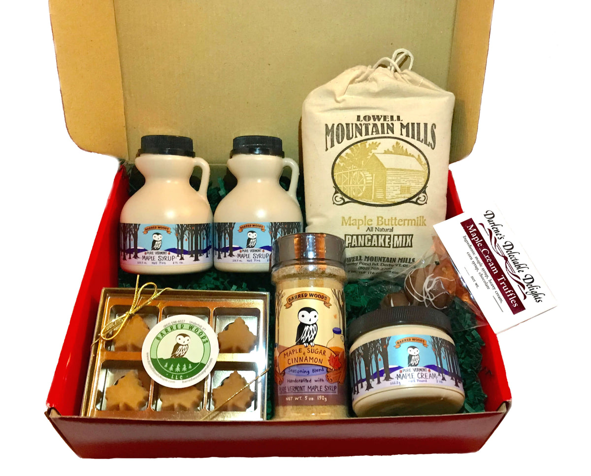 Maple gift box filled with maple treats including maple syrup and a maple candy gift box